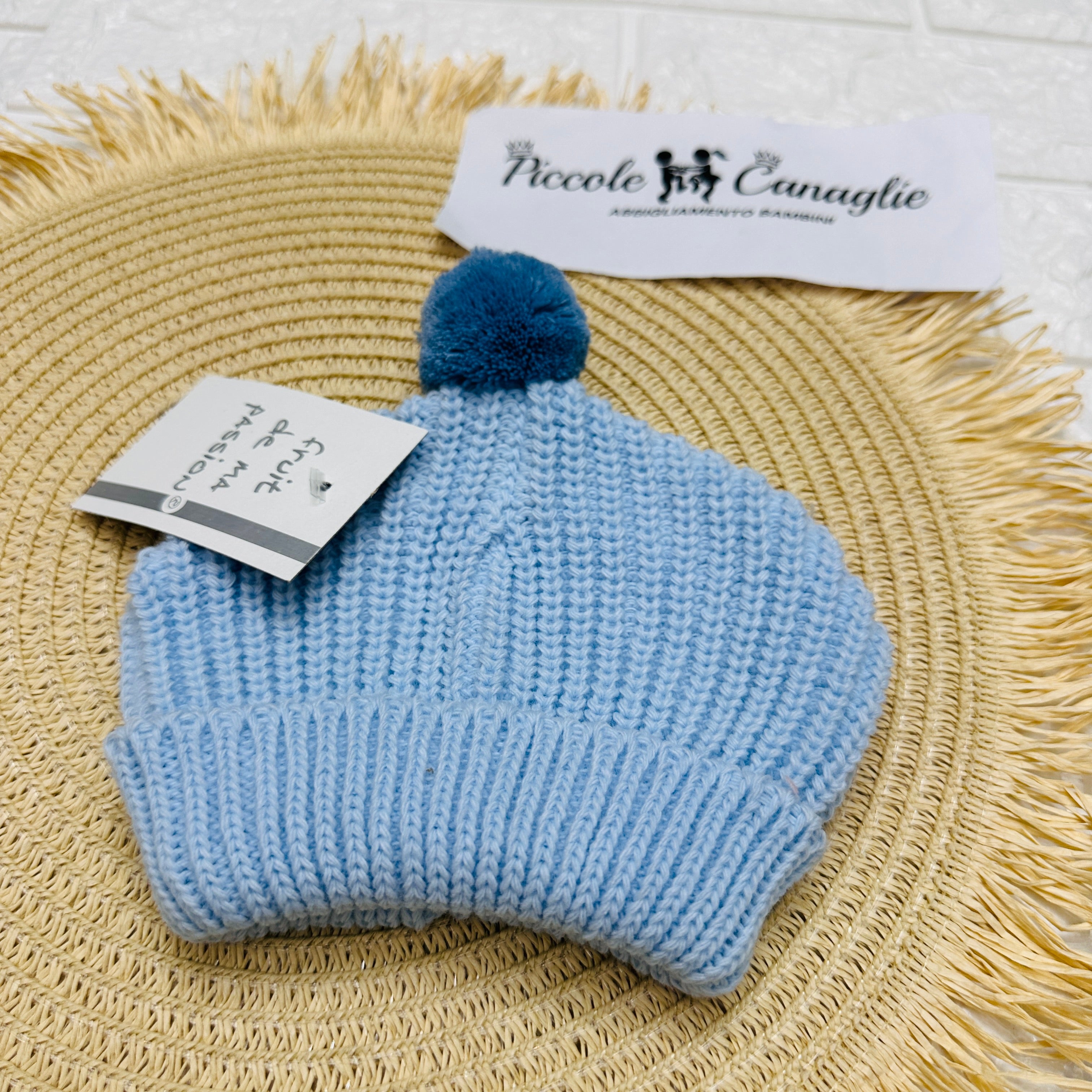 Cappellino PonPon celeste/avio Taglia 0-6mesi